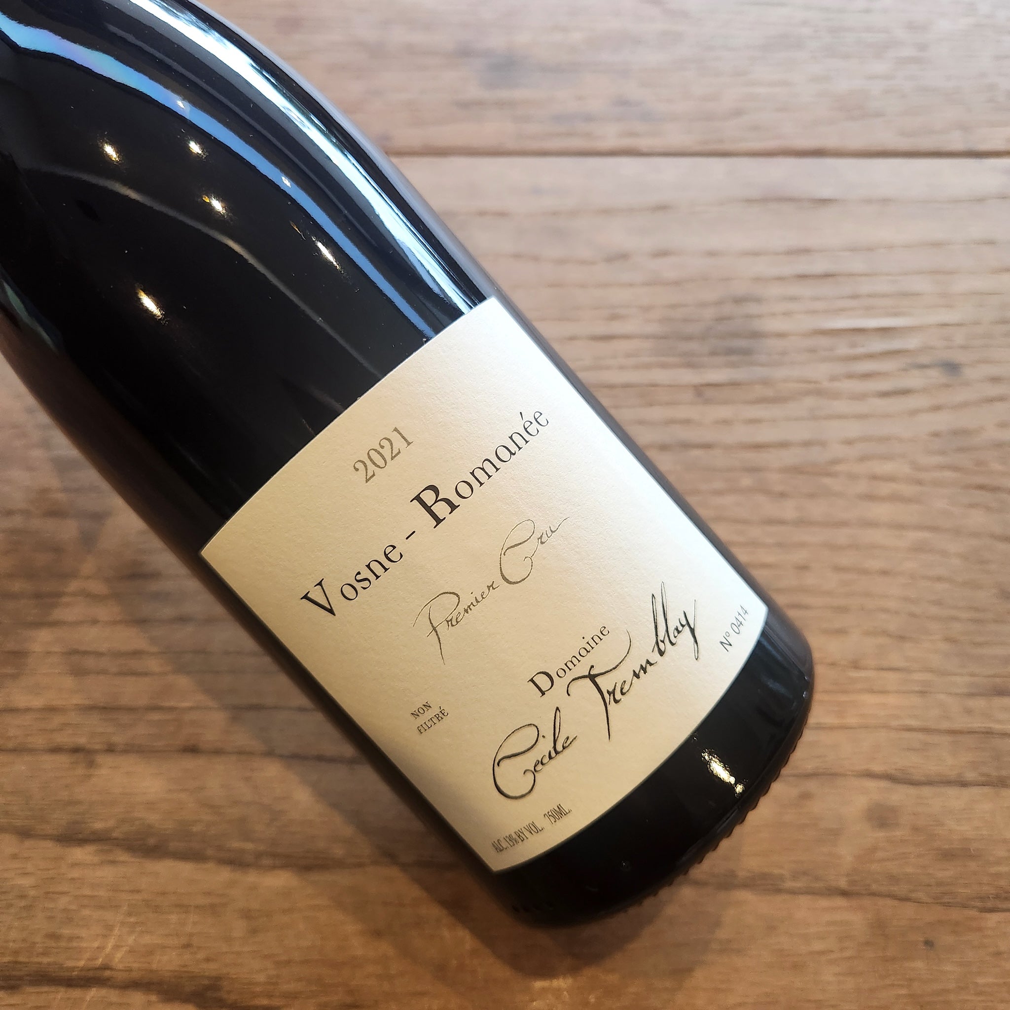 2021 Cecil Tremblay Vosne Romanee 1er Cru lying on a wooden surface.
